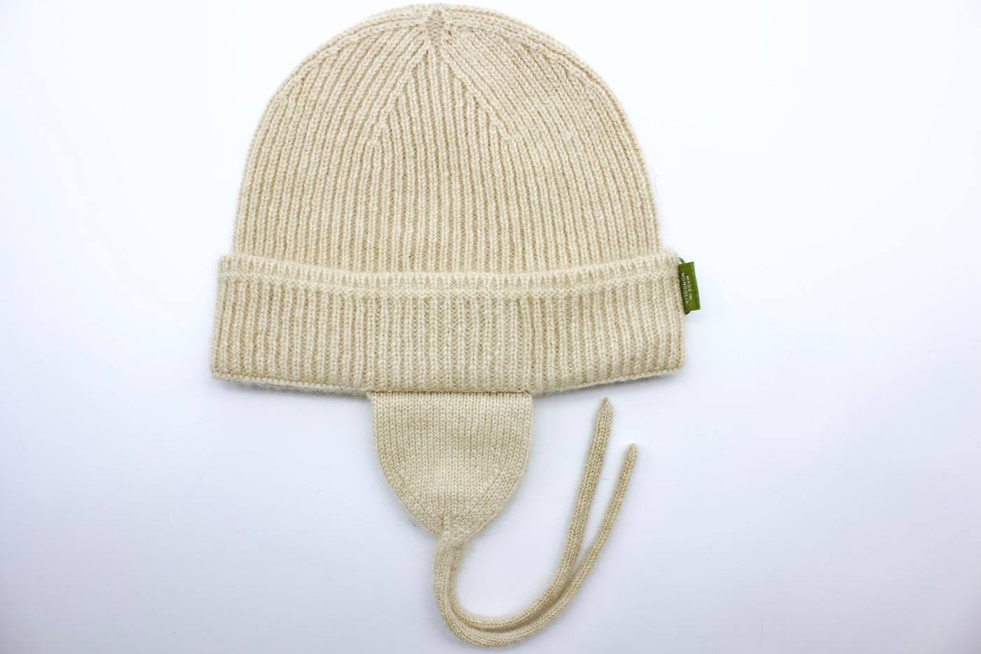 “Light beige Mongolian cashmere baby hat with earflaps and ties, soft ribbed knit for warmth and comfort”