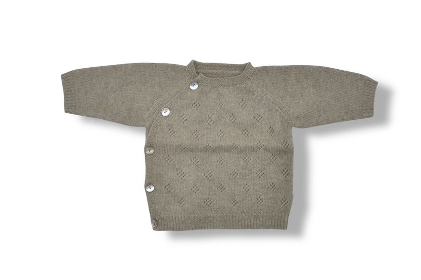 “Natural beige Mongolian cashmere baby cardigan with side buttons and delicate knit texture, soft and hypoallergenic”