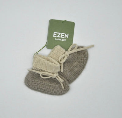 “Two-tone Mongolian cashmere baby booties with tie design, soft knit texture in beige and light brown, gentle and hypoallergenic”