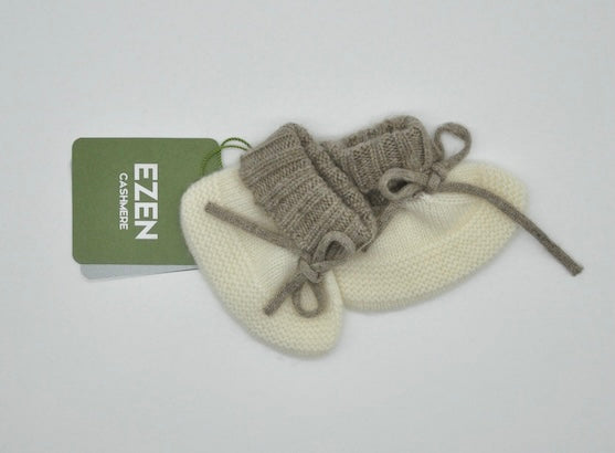 “Two-tone Mongolian cashmere baby booties with tie design, soft knit texture in cream white and light brown, gentle and hypoallergenic”