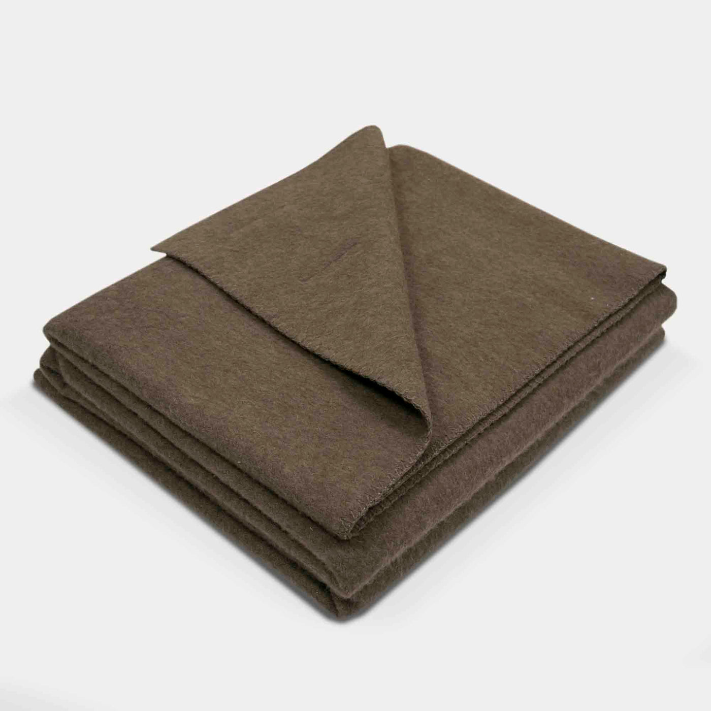 “Soft brown blanket made of 100% Mongolian yak wool, folded neatly, handcrafted for warmth and natural comfort.”