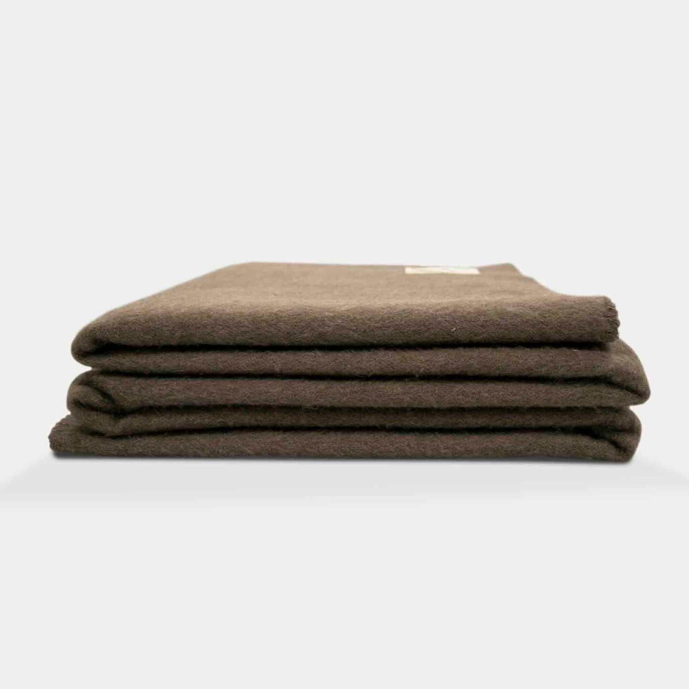 “Soft brown blanket made of 100% Mongolian yak wool, folded neatly, handcrafted for warmth and natural comfort.”