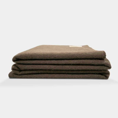 “Soft brown blanket made of 100% Mongolian yak wool, folded neatly, handcrafted for warmth and natural comfort.”