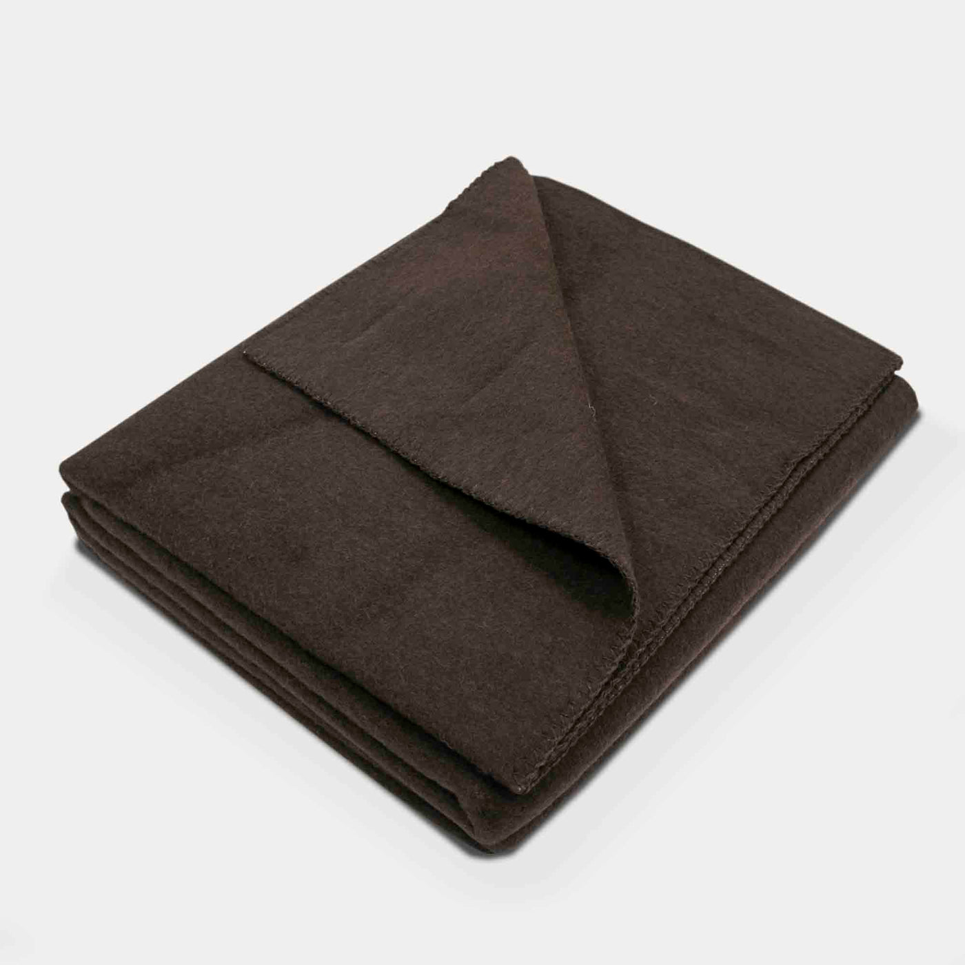 “Dark brown blanket made of 100% Mongolian yak wool, folded neatly, handcrafted for warmth and natural comfort.”