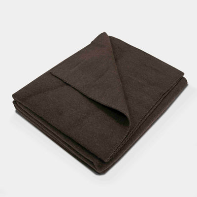 “Dark brown blanket made of 100% Mongolian yak wool, folded neatly, handcrafted for warmth and natural comfort.”
