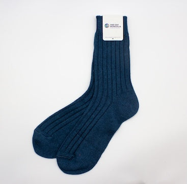 “Sea blue Mongolian wool blend socks with ribbed knit texture, 60% wool for warmth and comfort”
