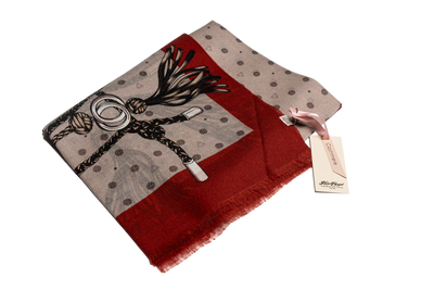 Printed cashmere–silk scarf in red and taupe tones with equestrian-inspired design, showcasing soft texture and lightweight luxury blend.