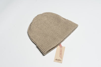 Beige 100% yak wool ribbed beanie with soft texture and minimalist design, showcasing natural warmth and sustainable craftsmanship.