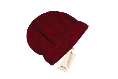 Burgundy Mongolian cashmere ribbed beanie with soft knit texture and rich tone, designed for warmth, comfort, and refined winter style.