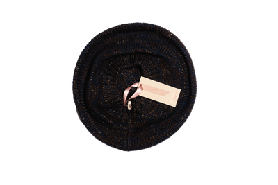 Midnight blue and brown Mongolian cashmere beret with fine metallic shimmer, featuring soft knit texture and elegant round silhouette.