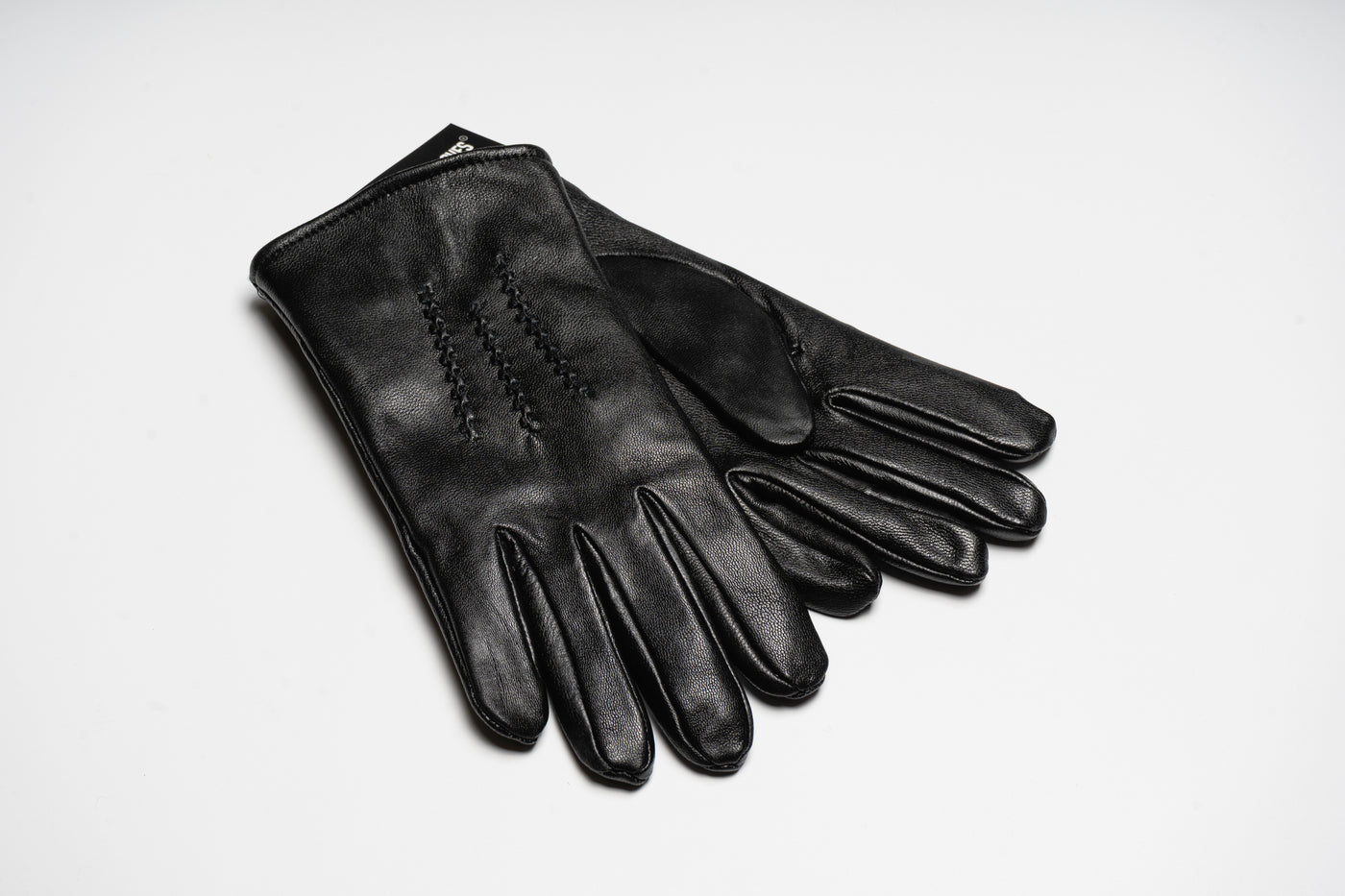 “Black men’s leather gloves with classic stitched detailing, smooth natural leather finish for warmth and elegant style”