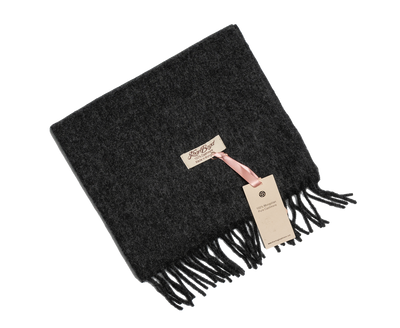 Black Mongolian cashmere scarf with fringe edges and soft texture, offering lightweight warmth and minimalist luxury design.