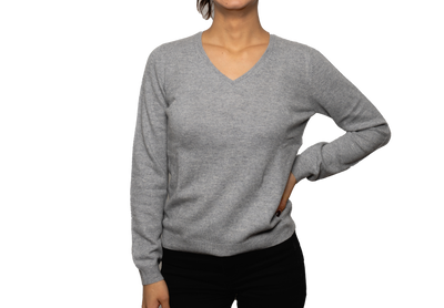 Women’s light gray V-neck cashmere sweater with soft knit texture and fitted design, offering natural warmth and minimalist luxury style.