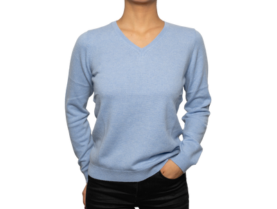 Women’s sky blue V-neck cashmere sweater with soft knit texture and fitted silhouette, offering lightweight warmth and refined everyday luxury.