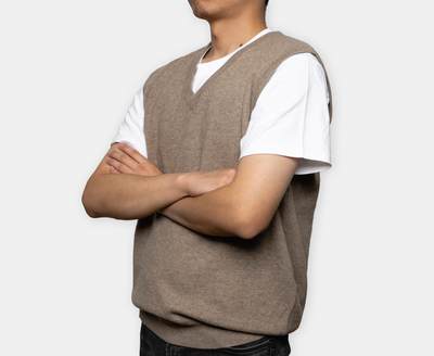 Natural brown V-neck cashmere vest with soft knit texture, crafted from pure Mongolian cashmere for a refined and versatile winter look.