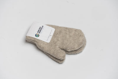 “Beige 100% Mongolian sheep wool kids mittens with soft knit texture, natural warmth and gentle comfort”