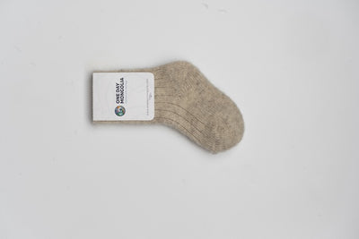 “Beige 100% Mongolian sheep wool kids socks with ribbed knit texture, soft and breathable for natural warmth”