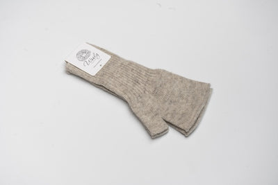 “Beige 100% Mongolian wool half mittens with ribbed knit texture, soft and breathable for warmth and finger flexibility”