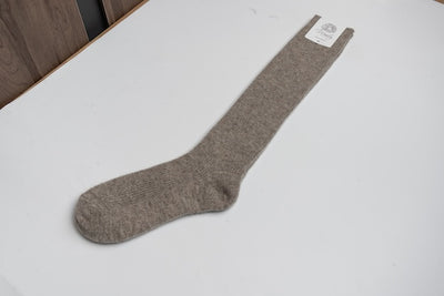 “Natural brown 100% Mongolian sheep wool long socks with ribbed knit texture, natural warmth and breathable comfort”