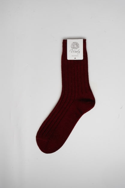 “Burgundy Mongolian wool blend socks with ribbed knit texture, 60% wool for warmth and comfort”