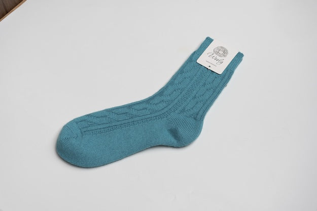 “Techno blue Mongolian wool blend socks with ribbed knit pattern, 60% wool for natural warmth and breathable comfort”