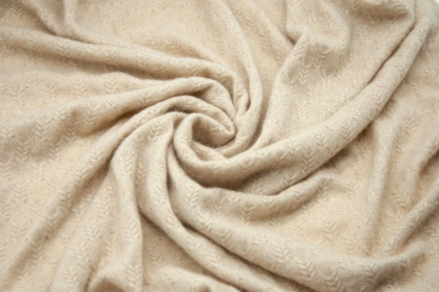 “Beige pure Mongolian cashmere baby blanket with delicate knit texture and soft finish, lightweight and naturally warm”
