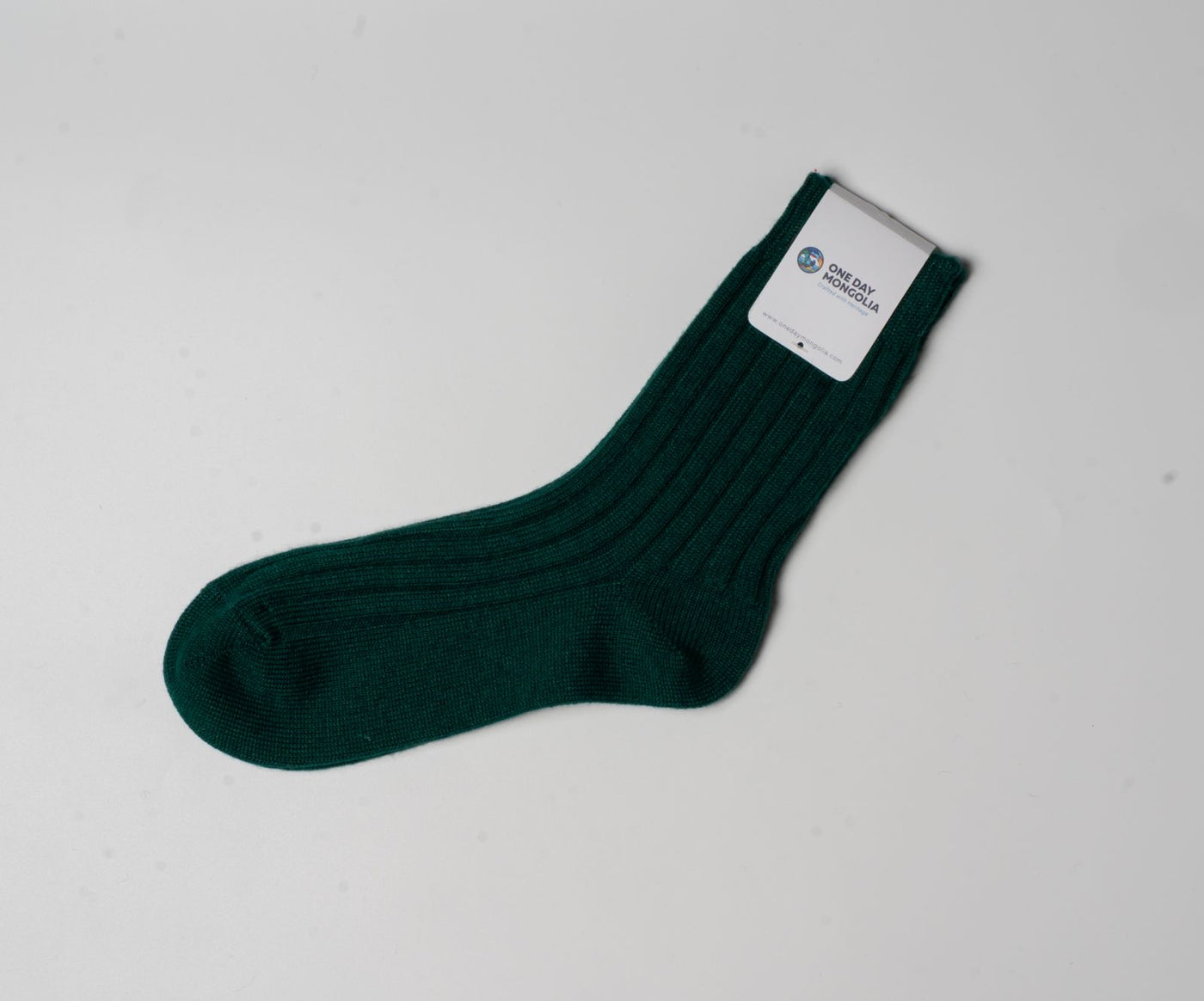 “Green wool blend Christmas sock made with 60% Mongolian sheep wool, ribbed texture, eco-friendly winter wear.”