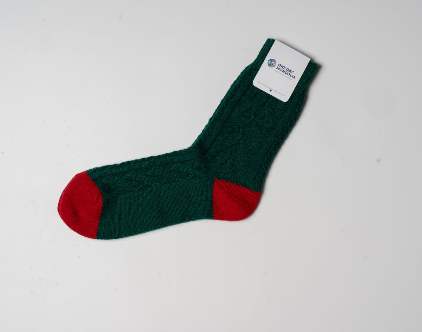“Green and Red wool blend Christmas sock made with 60% Mongolian sheep wool, ribbed texture, eco-friendly winter wear.”