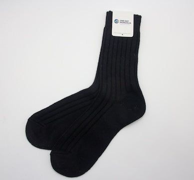 “Black Mongolian wool blend socks with ribbed knit texture, 60% wool for warmth and comfort”