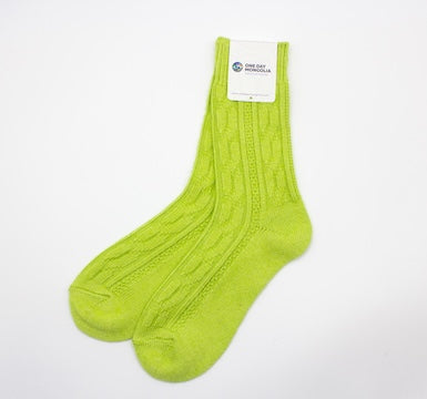 “Bright green Mongolian wool blend socks with ribbed knit pattern, 60% wool for natural warmth and breathable comfort”