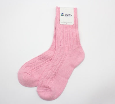 “Baby pink Mongolian wool blend socks with ribbed knit pattern, 60% wool for natural warmth and breathable comfort”