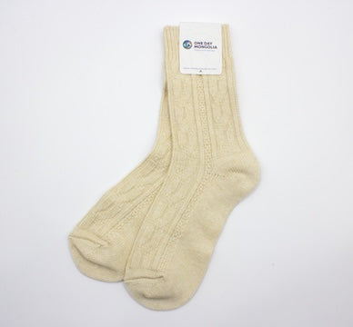 “Beige Mongolian wool blend socks with ribbed knit pattern, 60% wool for natural warmth and breathable comfort”