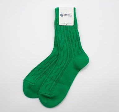 “Green Mongolian wool blend socks with ribbed knit pattern, 60% wool for natural warmth and breathable comfort”